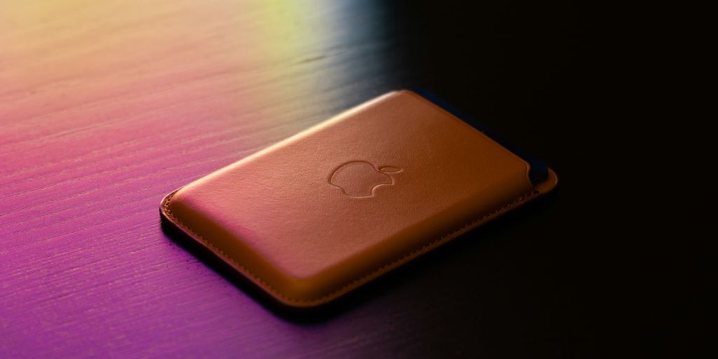 gold apple tv on brown wooden table